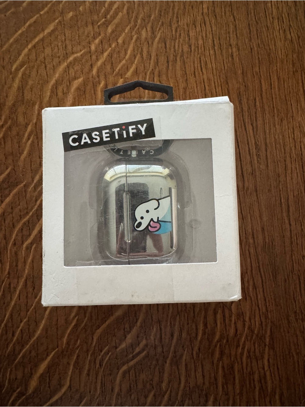 Casetify Silver AirPods Case with White Cartoon and Blue & Pink Accents